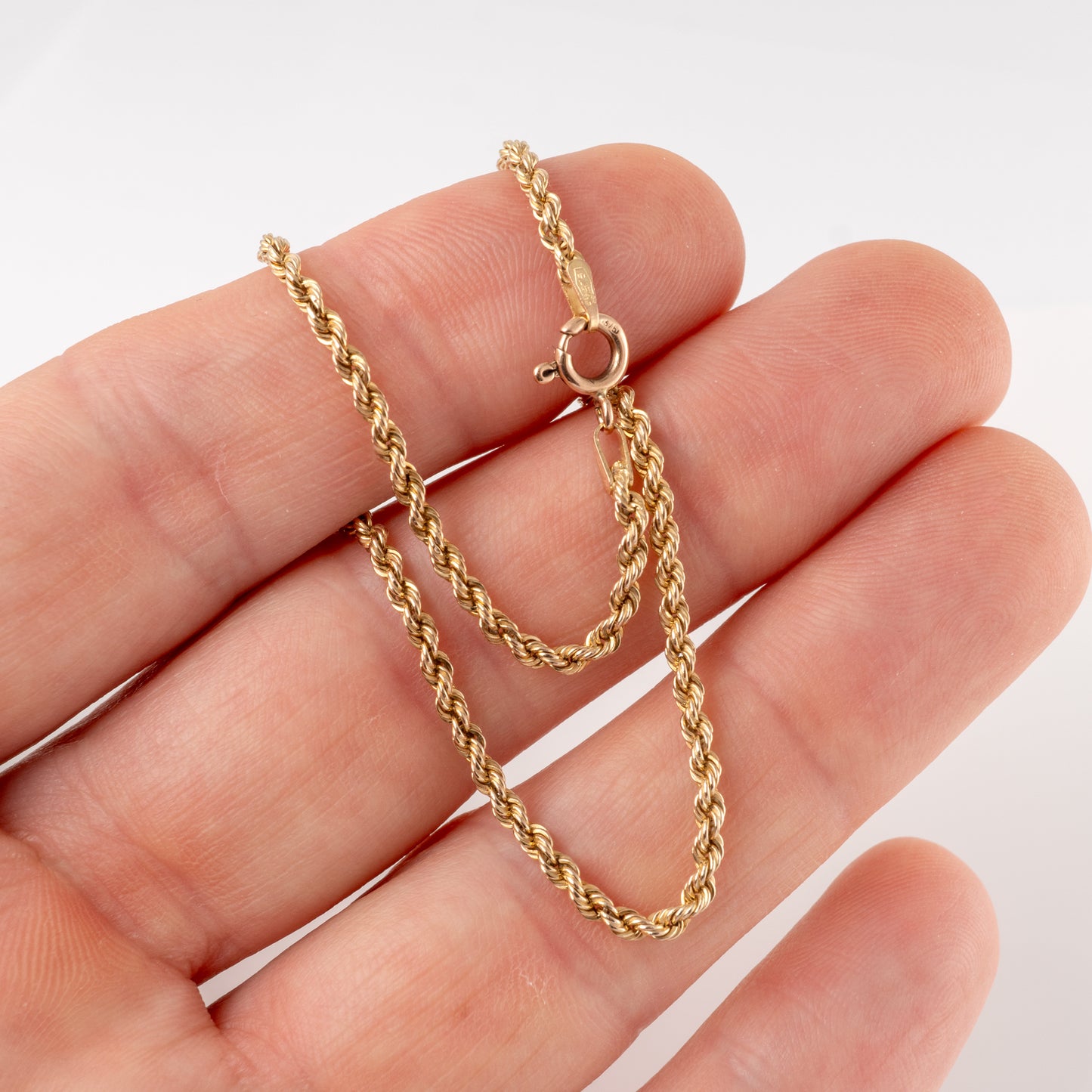 Pre-owned 375 gold rope chain bracelet held in hand, twisted rope link – Hunters Fine Jewellery.