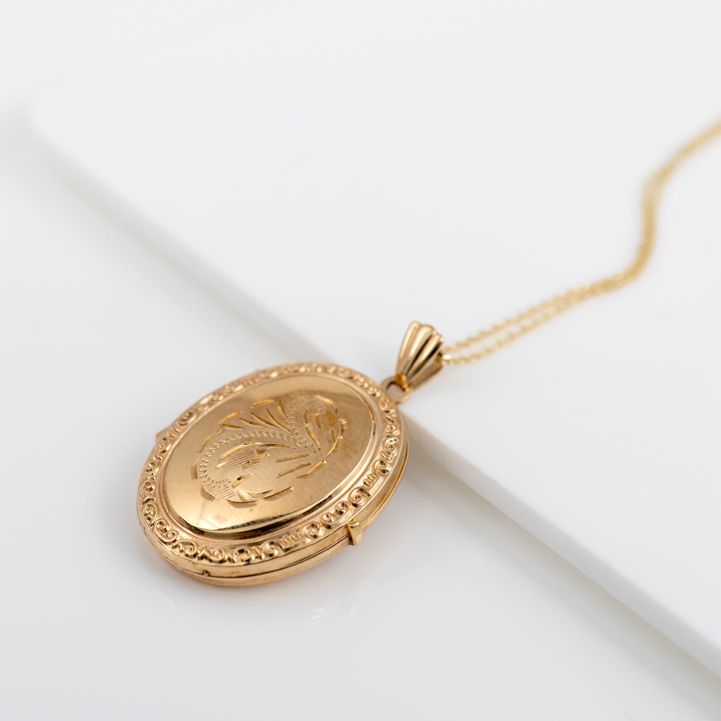 oval gold locket necklace side 