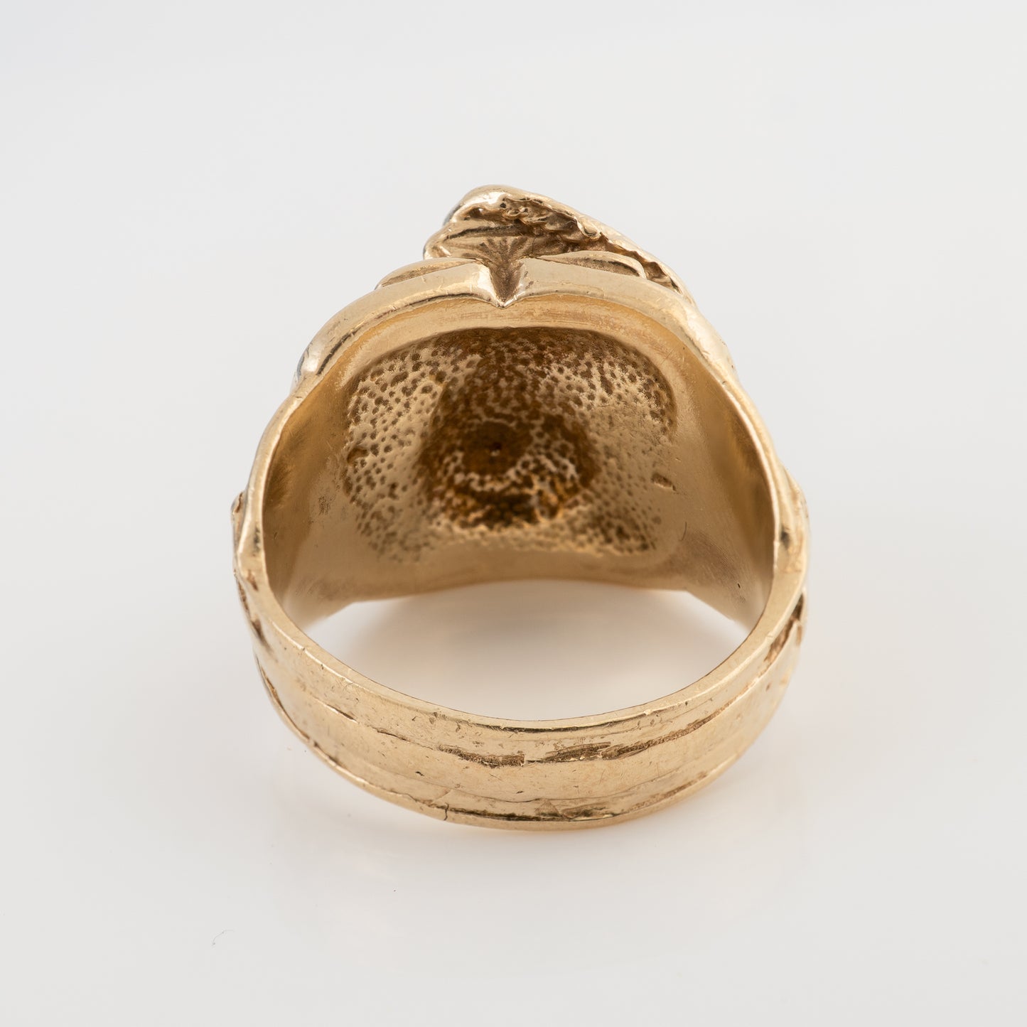 Reverse view of a vintage men's 9ct gold saddle ring showing the detailed back and solid gold construction.