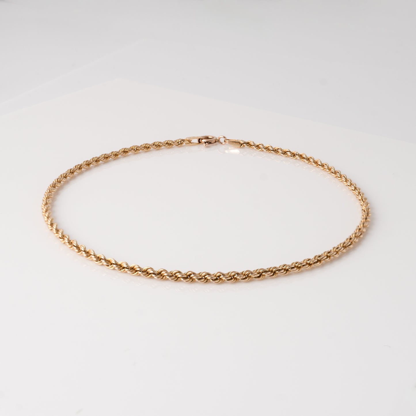 375 gold rope chain bracelet on white background, showing twisted rope style – Hunters Fine Jewellery.