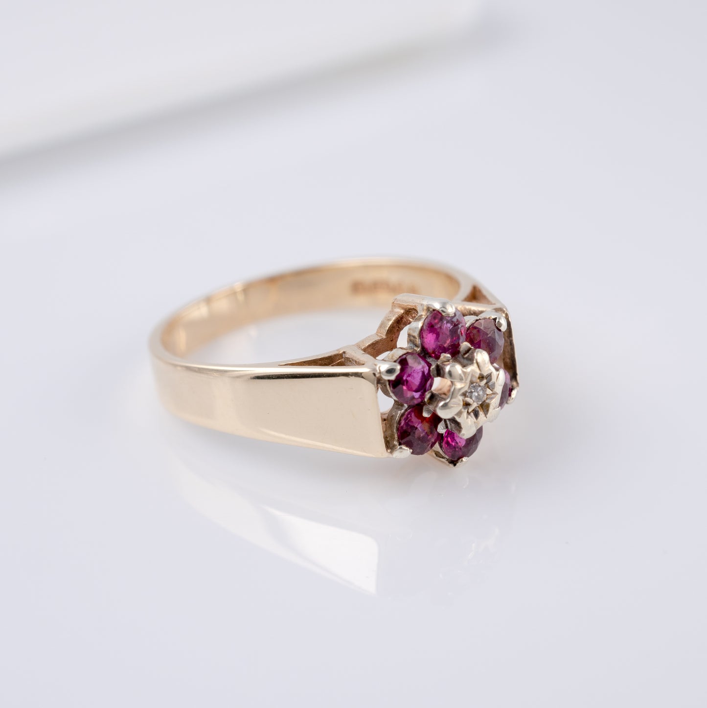 chunky gold ring with ruby diamond halo