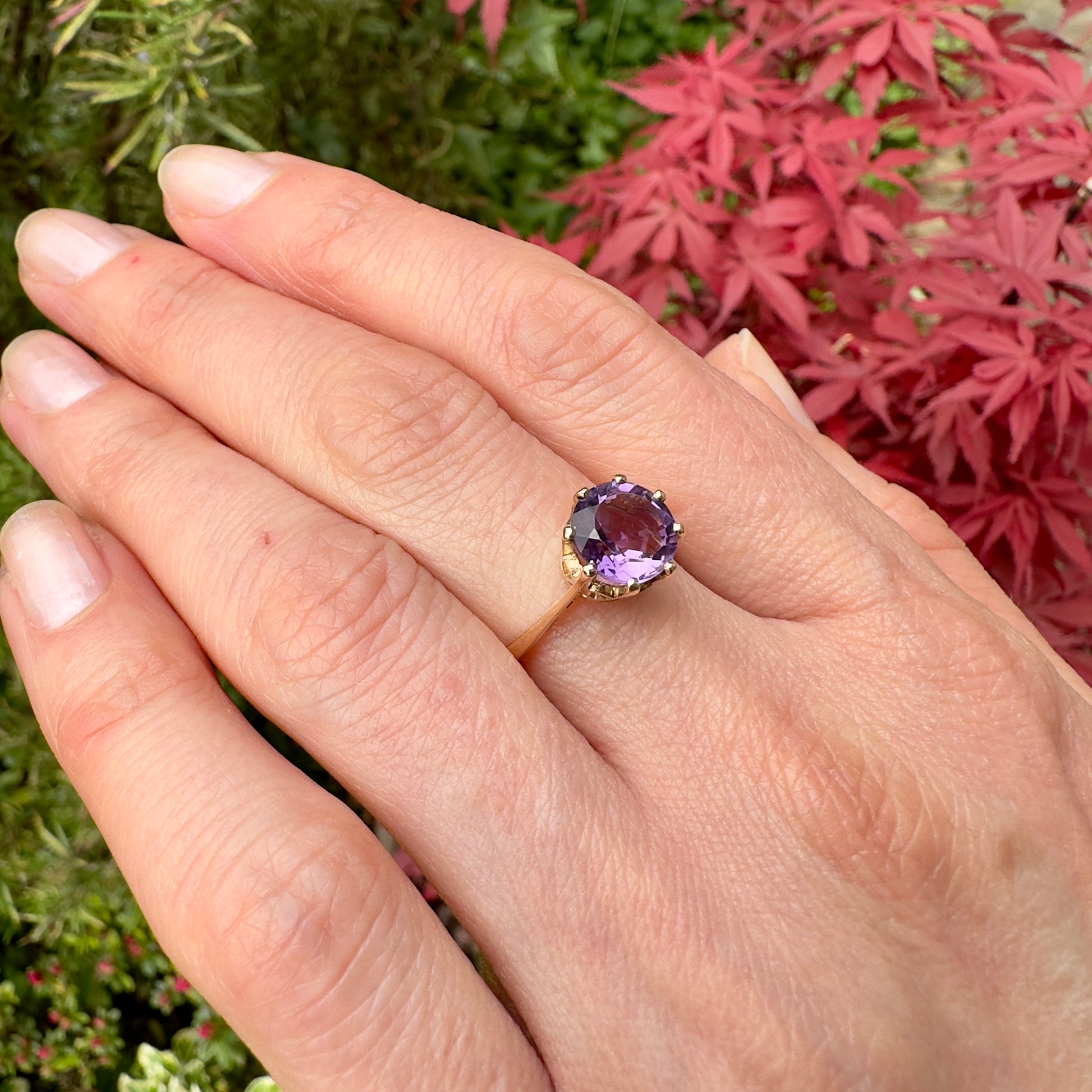 vintage amethyst solitaire ring womans hand