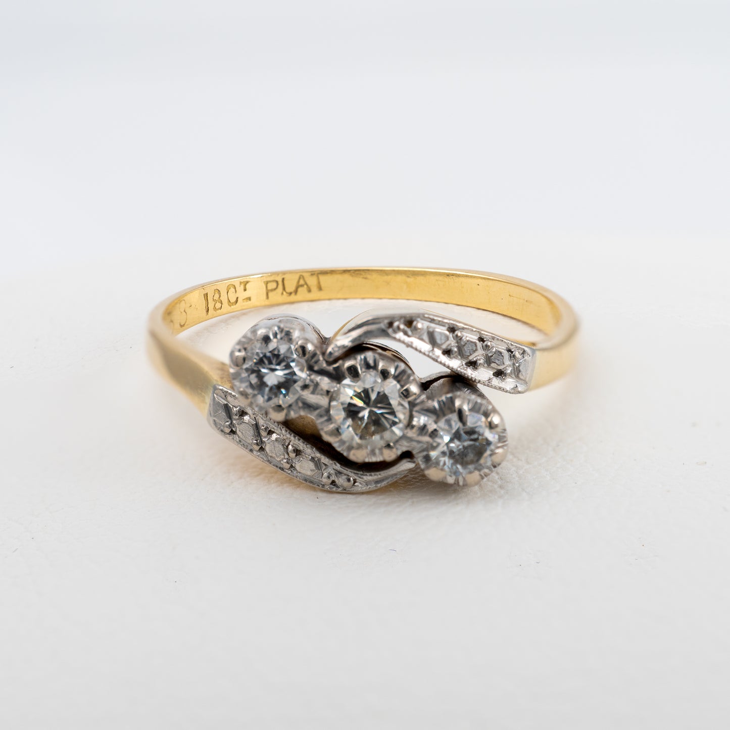 Front of vintage three stone diamond engagement ring
