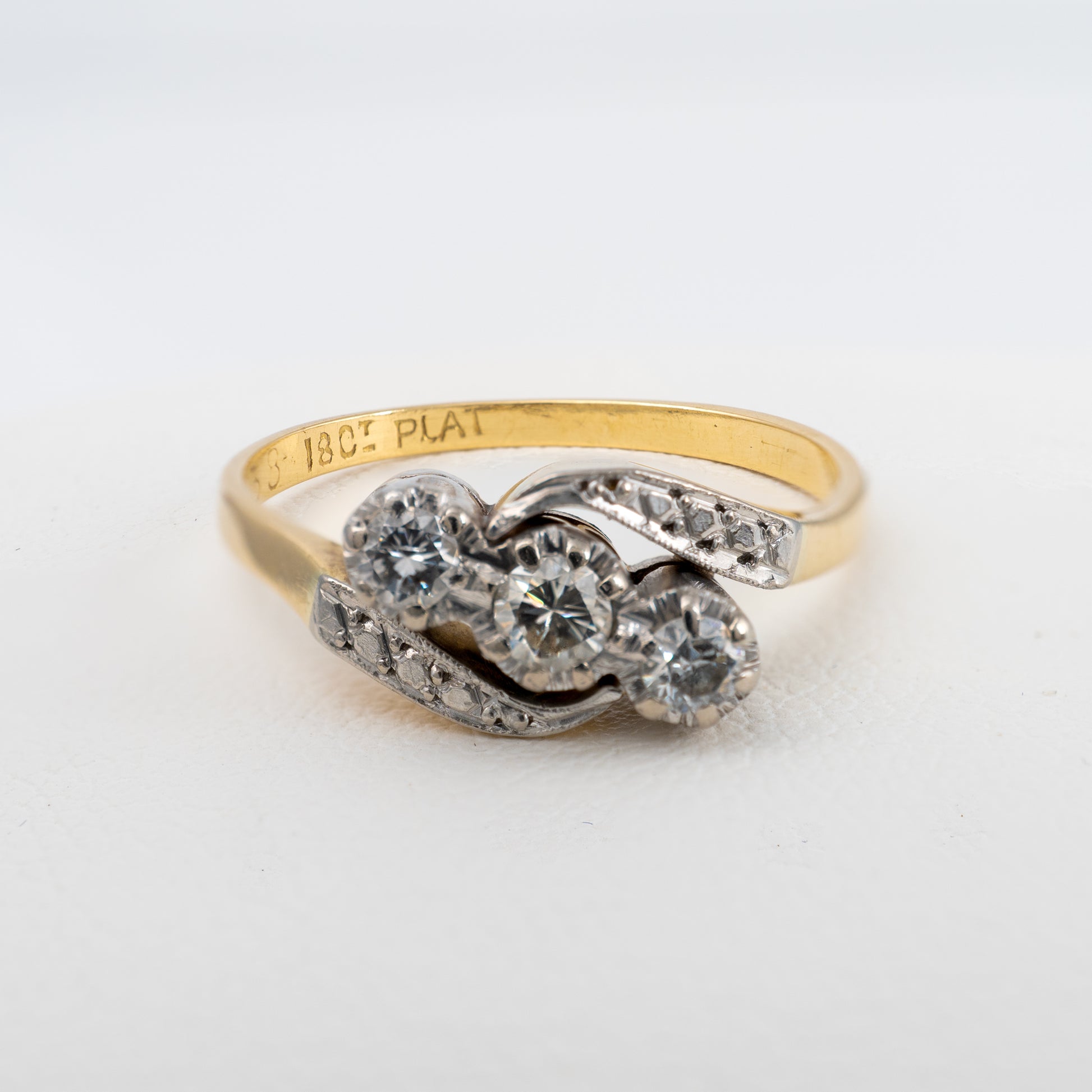 Front of vintage three stone diamond engagement ring