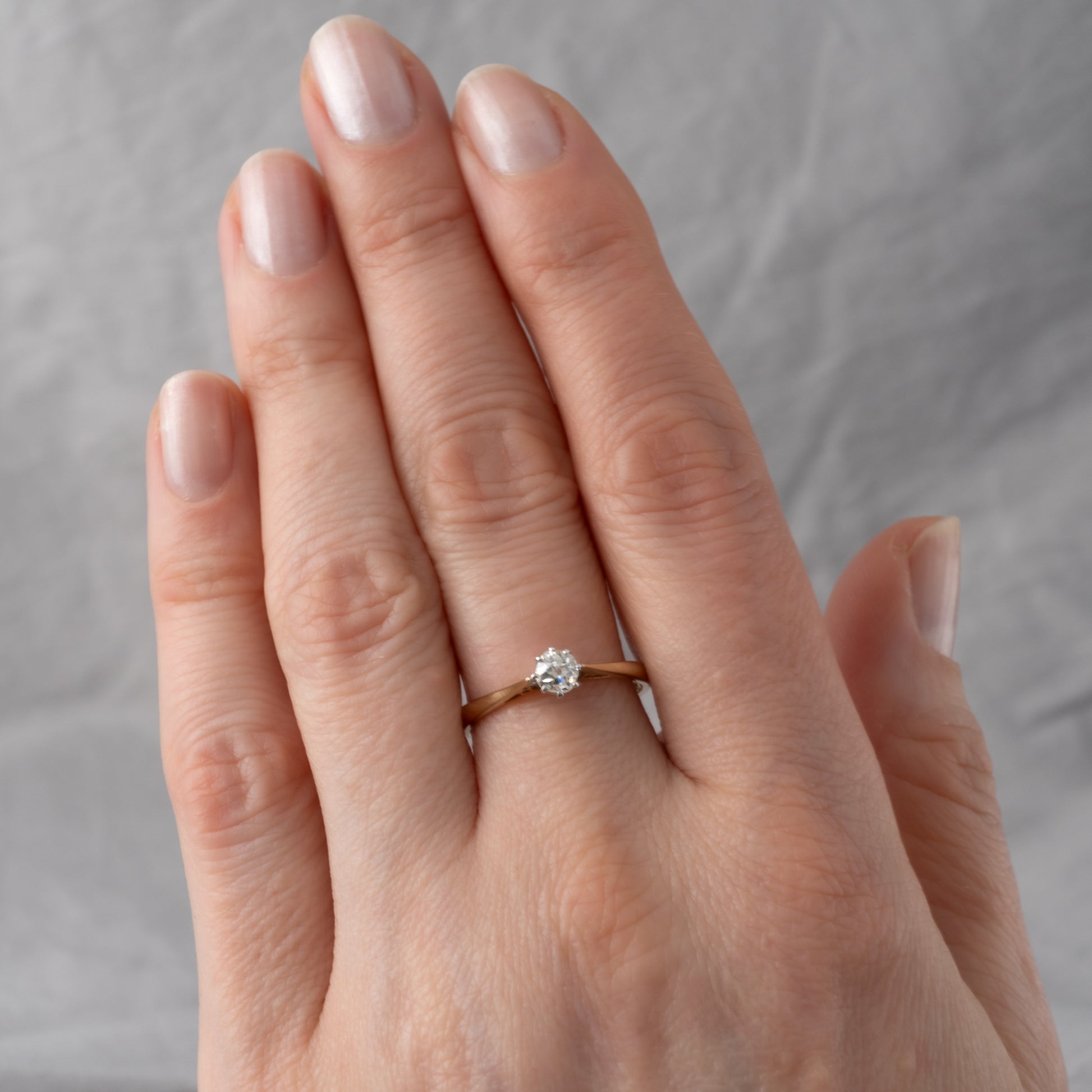 vintage old cut diamond ring on womans hand to show how it will look