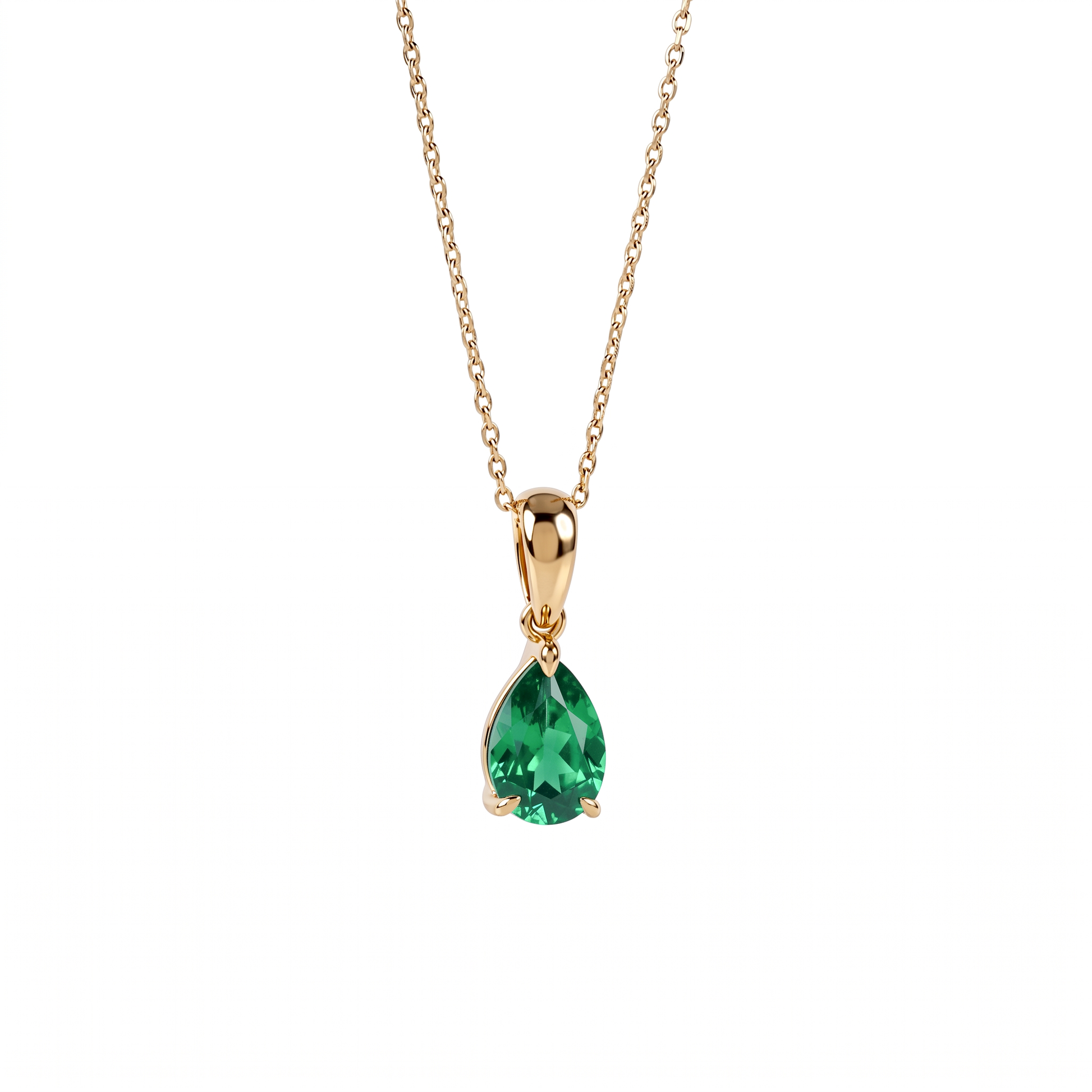 A gold pendant necklace featuring a teardrop-shaped lab emerald gemstone, suspended from a delicate gold chain against a plain white background.