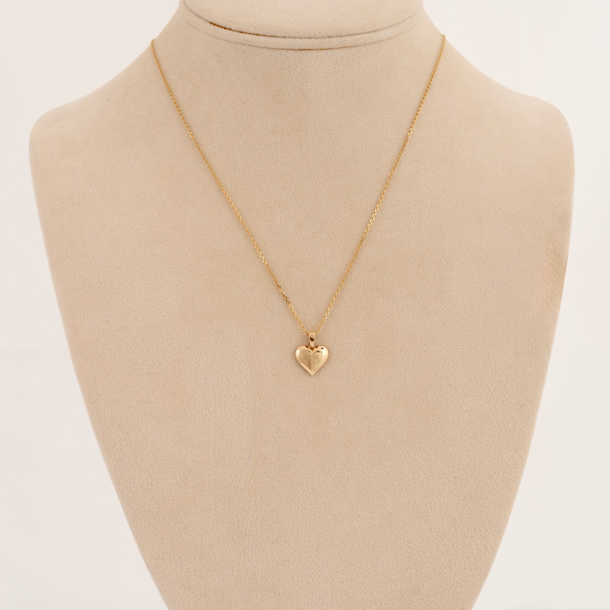 9ct gold heart necklace shown on display bust