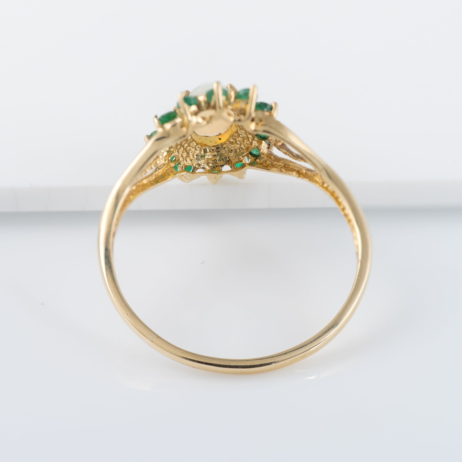 opal ring with green emerald accents in flower setting - hunters fine jewellery