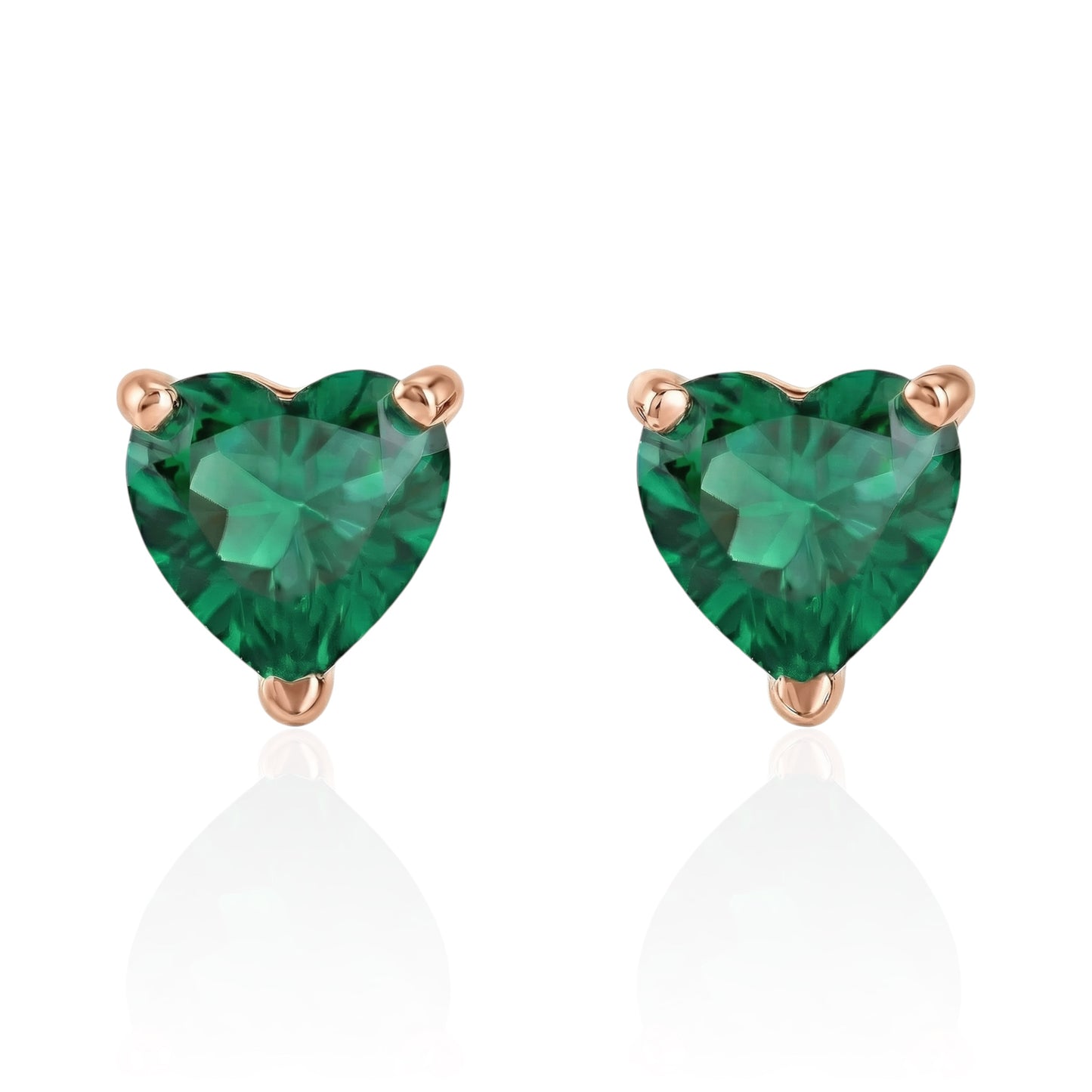 emerald heart earrings with rose gold posts on a white background