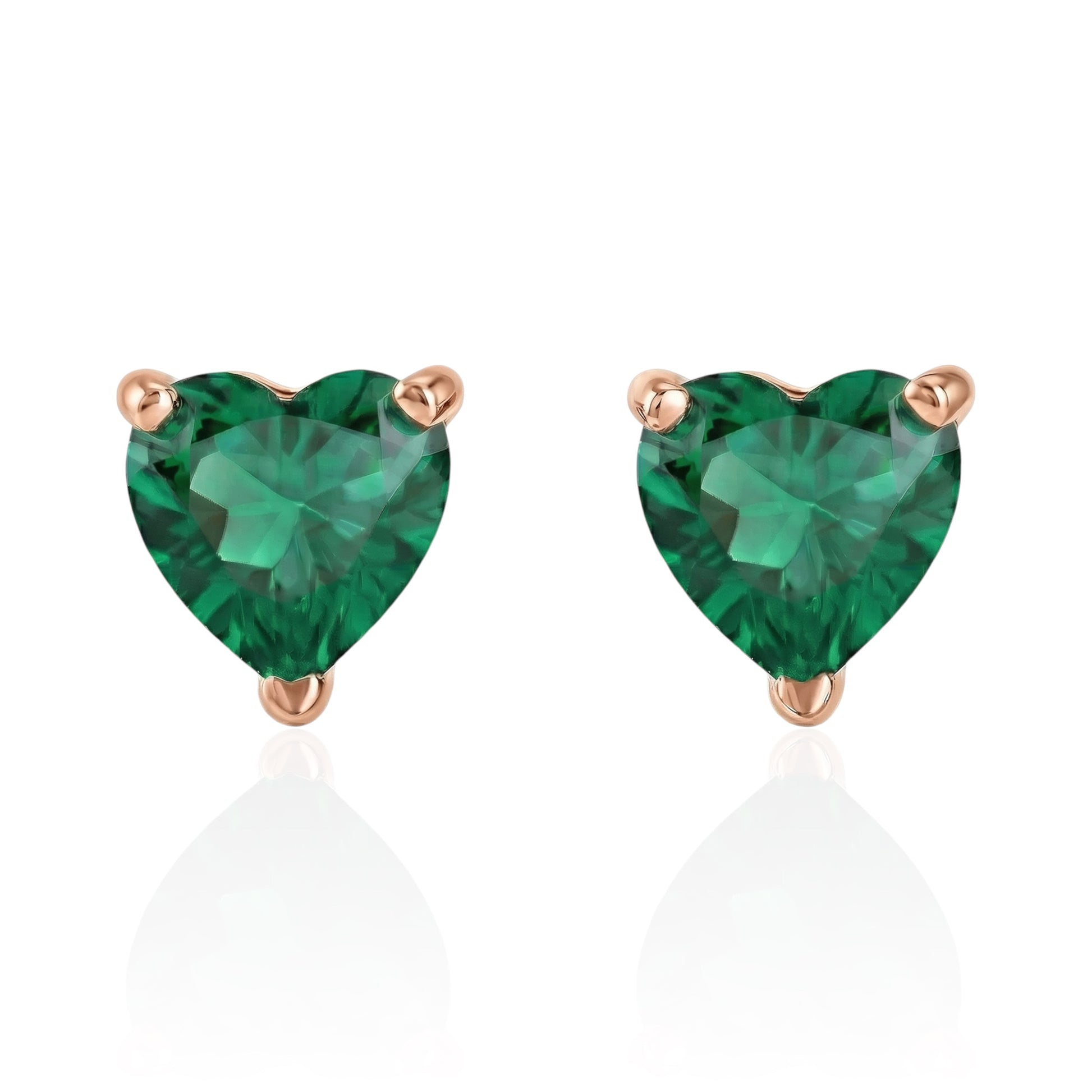 emerald heart earrings with rose gold posts on a white background