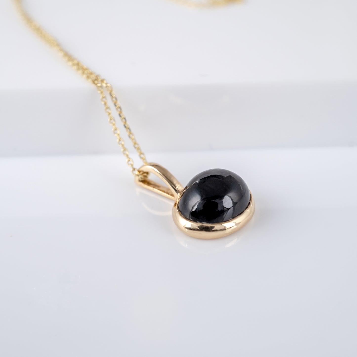 black stone necklace yellow gold