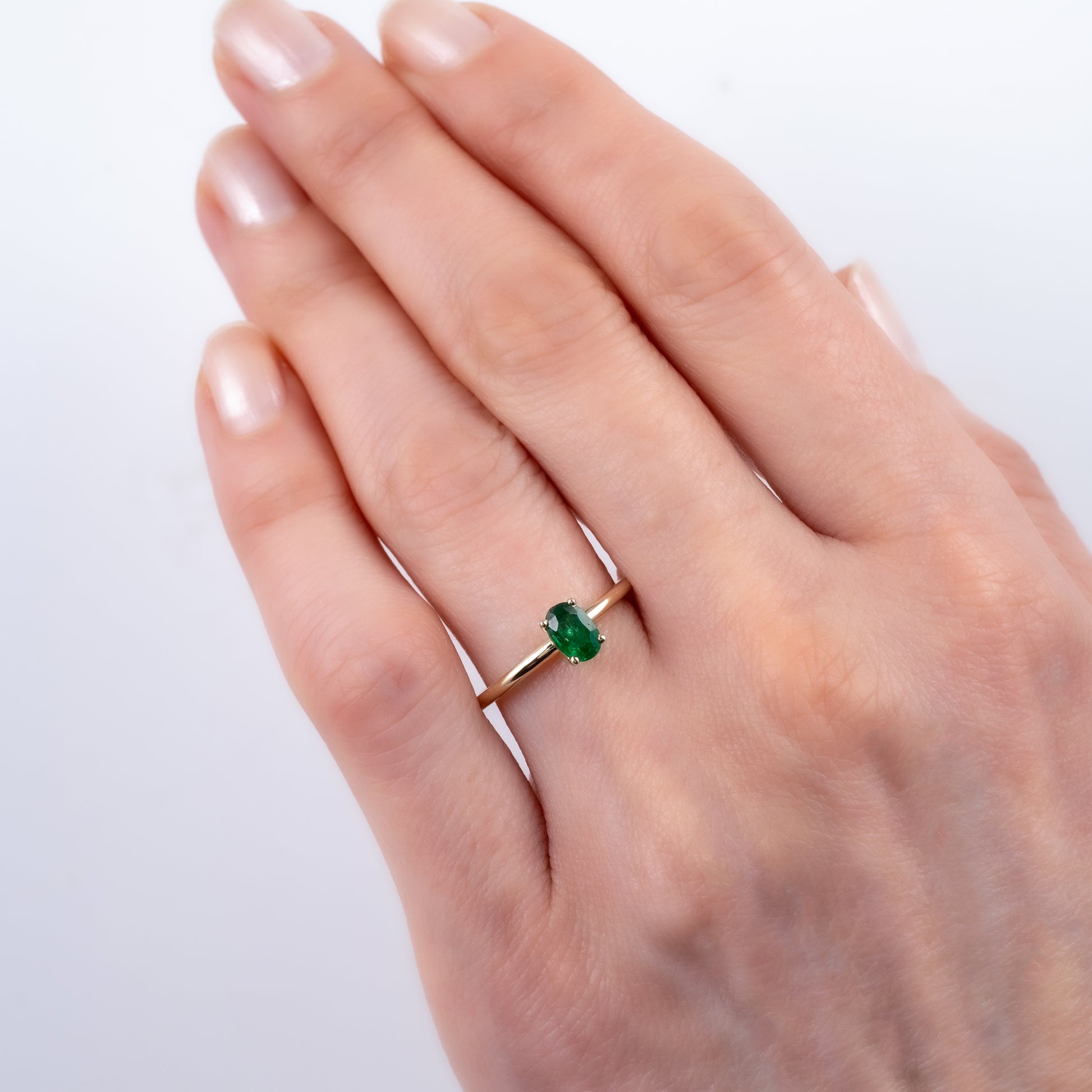 oval emerald solitaire ring
