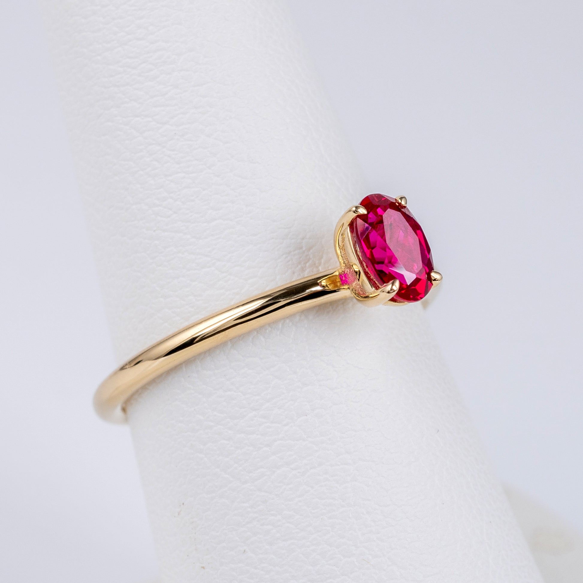 oval ruby solitaire ring